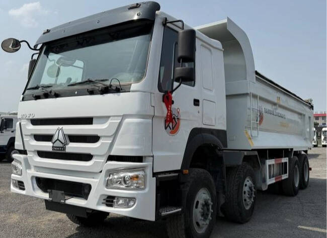 Product appearance Used Howo 371 large pump engine dump truck is a near-new truck. The paint color of the body is various, including original red/white/green/yellow, etc., which is as bright as new, without obvious scratches or rust. The accessories are complete and as new as new, and the overall truck is close to new, with no obvious signs of use. Howo 371 Large Pump Engine Dump Trucks Product core configuration Power system: Engine: Equipped with Sinotruk WD615.96NE or WD615.47 large pump engine, with an output power of 371 horsepower and a maximum torque of 1900N·m, it meets the National II/National III emission standards and is suitable for low-sulfur diesel environments. The large pump engine has a simple structure, strong versatility of accessories, convenient maintenance, and does not need to rely on the electronic control system to reduce the failure rate. Howo 371 Large Pump Engine Dump Trucks 1 Chassis and load-bearing: Frame: Adopts a double-layer frame (8+8mm thickness), with HF9 front axle and AC16 double-stage reduction rear axle (speed ratio 5.45), with a load capacity of more than 30 tons, suitable for mining and infrastructure transportation. Suspension: Front and rear multi-leaf spring steel plate suspension (10/12 leaves), enhanced impact resistance. Cargo box and hydraulic system: Cargo box size: optional 5.4m/5.8m/6.5m length, manganese steel material (bottom 10 side 8 or higher strength), bottom five longitudinal beams reinforced design, strong anti-deformation ability. Howo 371 Large Pump Engine Dump Trucks 2 Product advantages Strong scene adaptability: Suitable for short-distance heavy-load transportation such as mines, ports, and infrastructure, and has outstanding performance in infrastructure projects in Africa, the Middle East and other regions. Price competitiveness: The price of the basic version is significantly lower than similar models of European and American brands, with outstanding cost performance. Howo 371 Large Pump Engine Dump Trucks 3 Product market and application scenarios Africa: With high load-bearing capacity and durability, it occupies the mainstream market for mining dump trucks. Southeast Asia: Adapts to high temperature and rainy environments and meets the needs of infrastructure projects. Howo 371 Large Pump Engine Dump Trucks 4